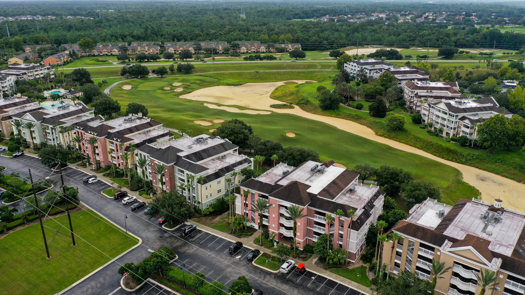drone shot of condo with golf course